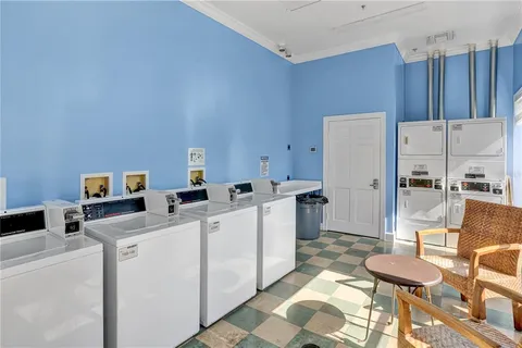 a view of a swimming pool with outdoor seating