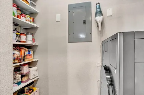 a bedroom with a bed a lamp and a dresser