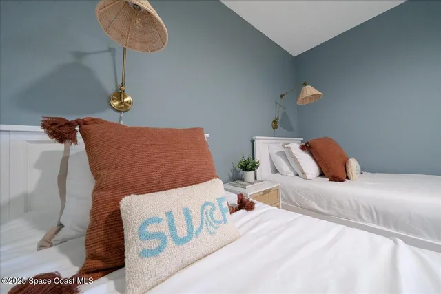 a bathroom with a sink a toilet a mirror and shower