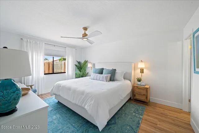 a kitchen with stainless steel appliances granite countertop a sink a stove top oven a refrigerator and dishwasher