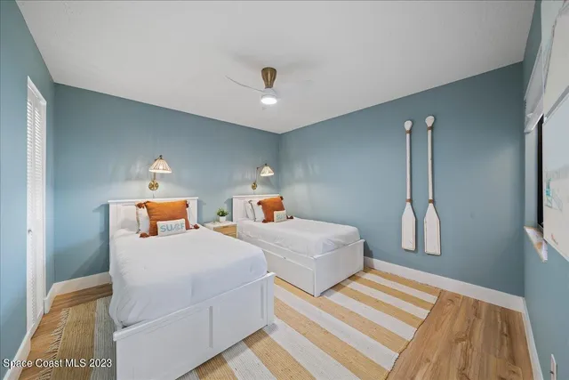 a white toilet sitting next to a shower curtain