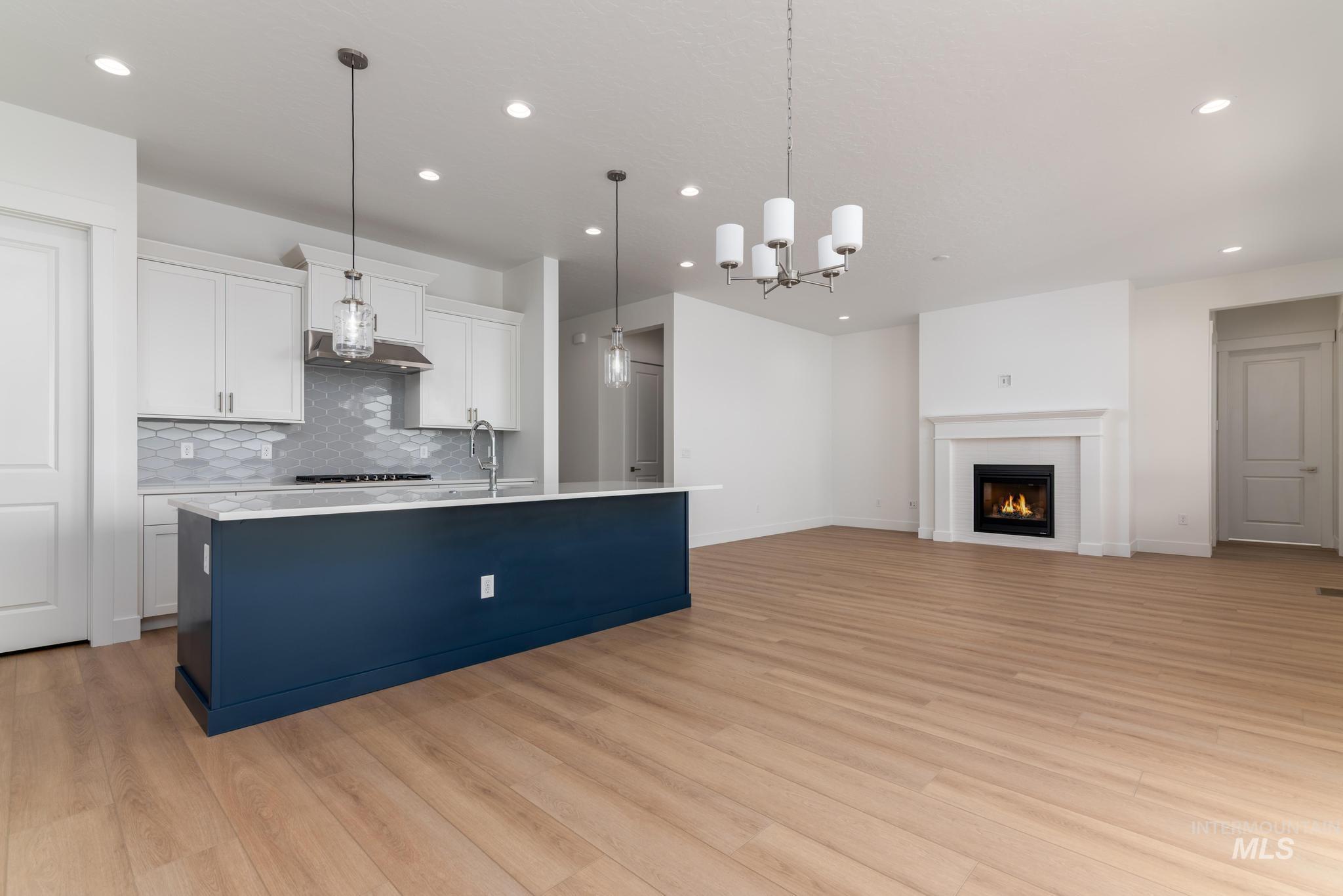 1195 West Switchgrass Drive Meridian, ID 83642 - Photo 5 of 22 Open-concept living space featuring wood-finish flooring