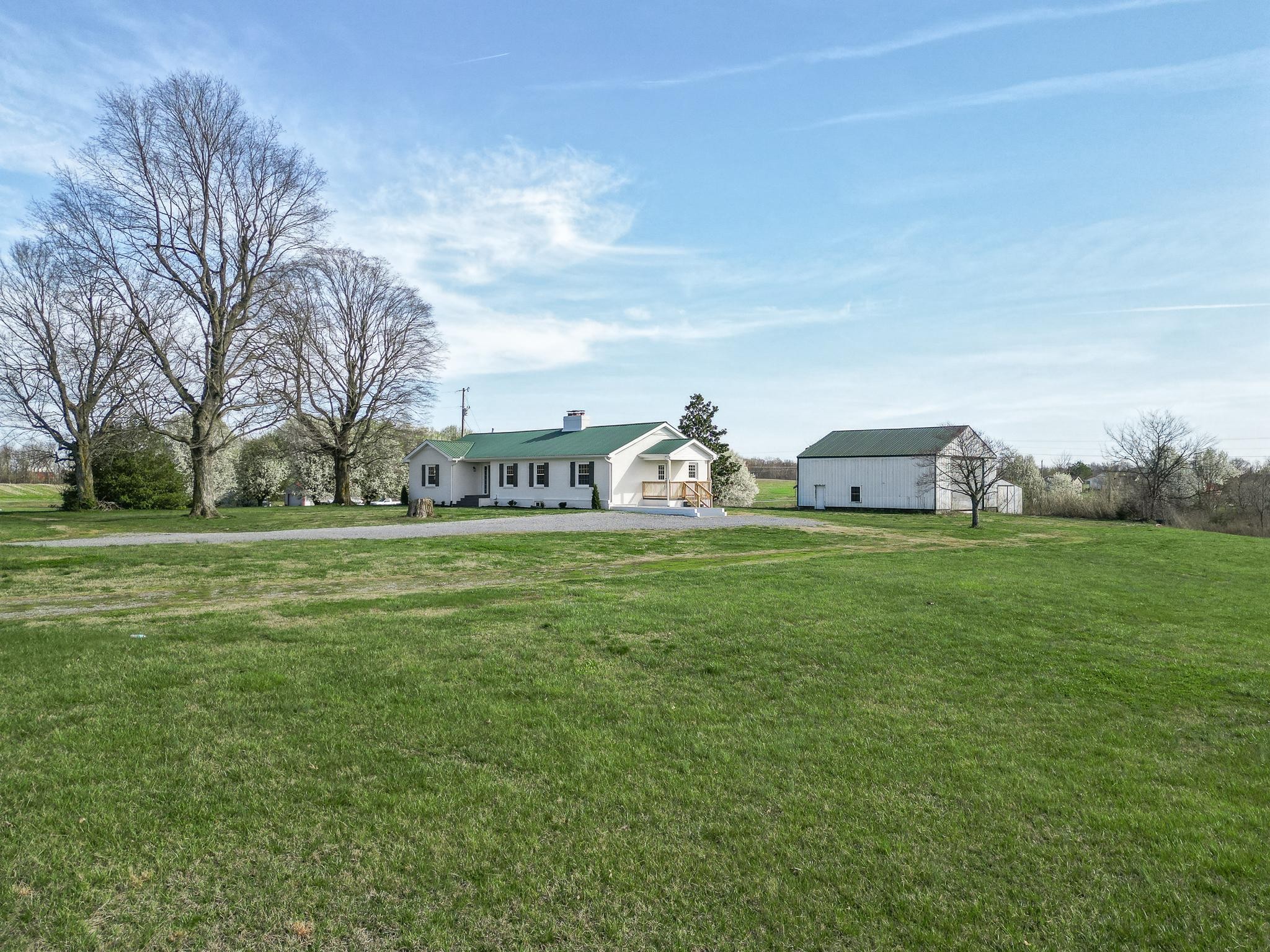 2771 Kinneys Road Cedar Hill, TN 37032 - Photo 1 of 45 a front view of a house with garden