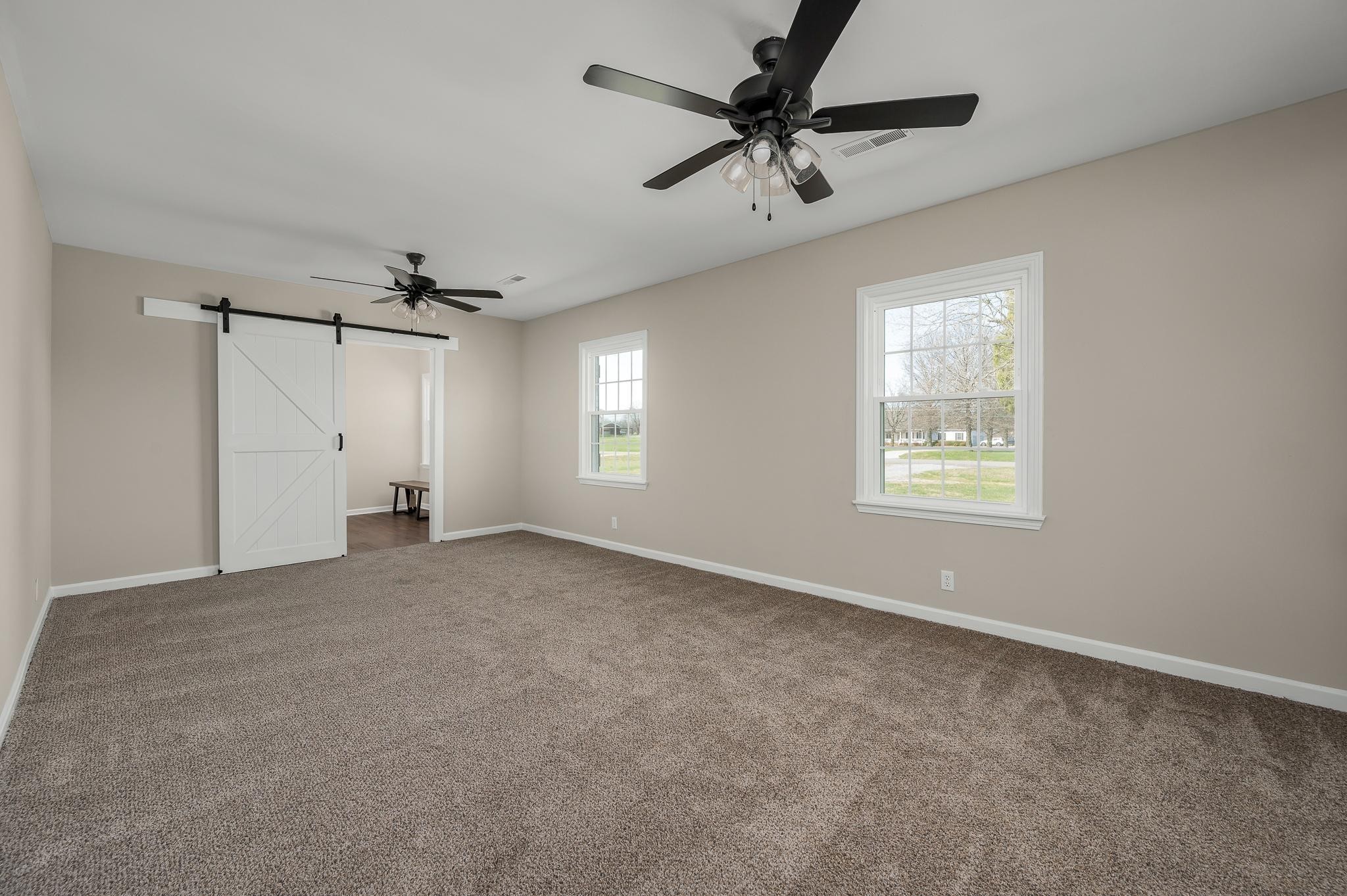 2771 Kinneys Road Cedar Hill, TN 37032 - Photo 14 of 45 an empty room with a window and a fan