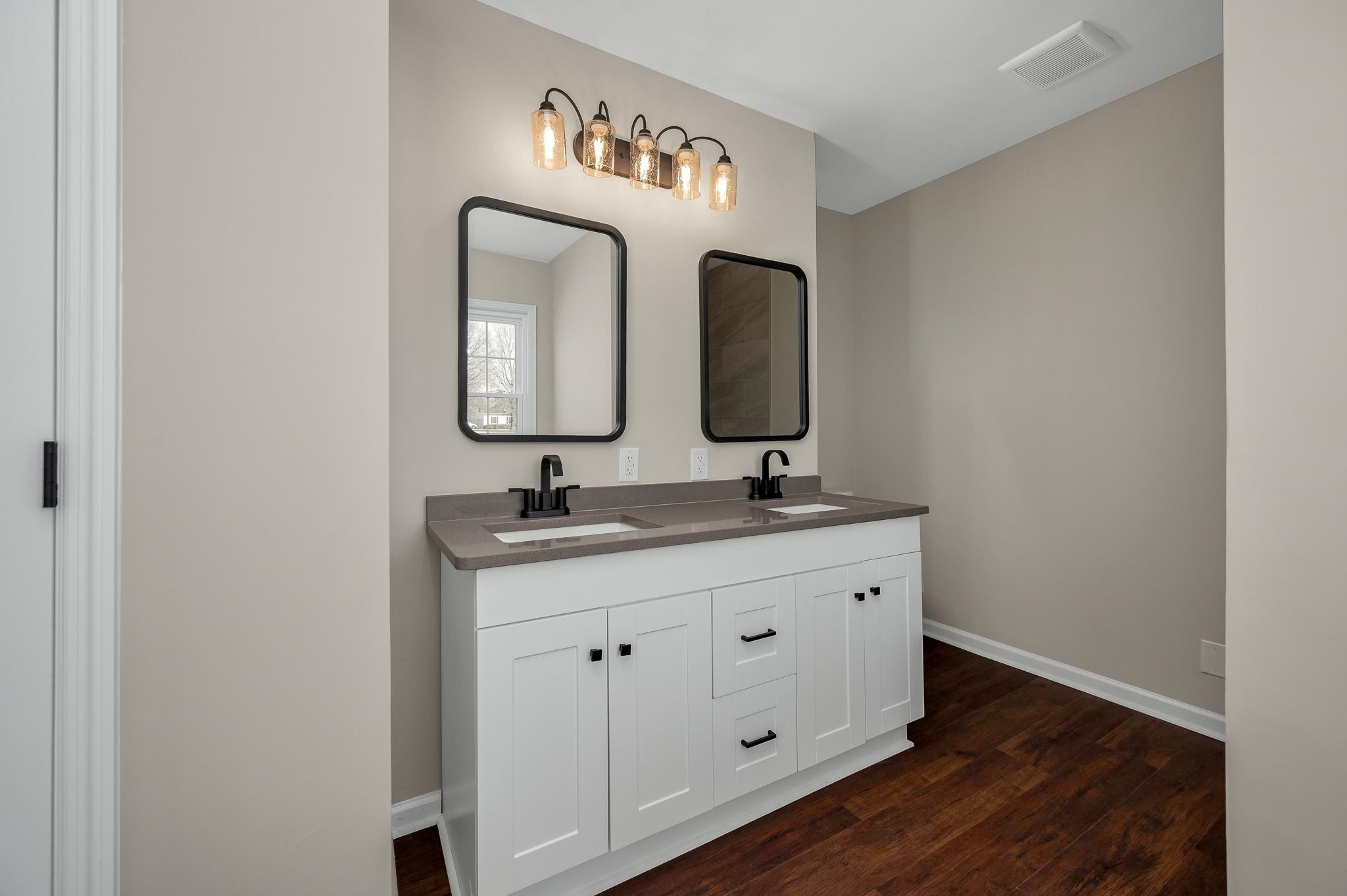 2771 Kinneys Road Cedar Hill, TN 37032 - Photo 17 of 45 a bathroom with 2 sink and a mirror