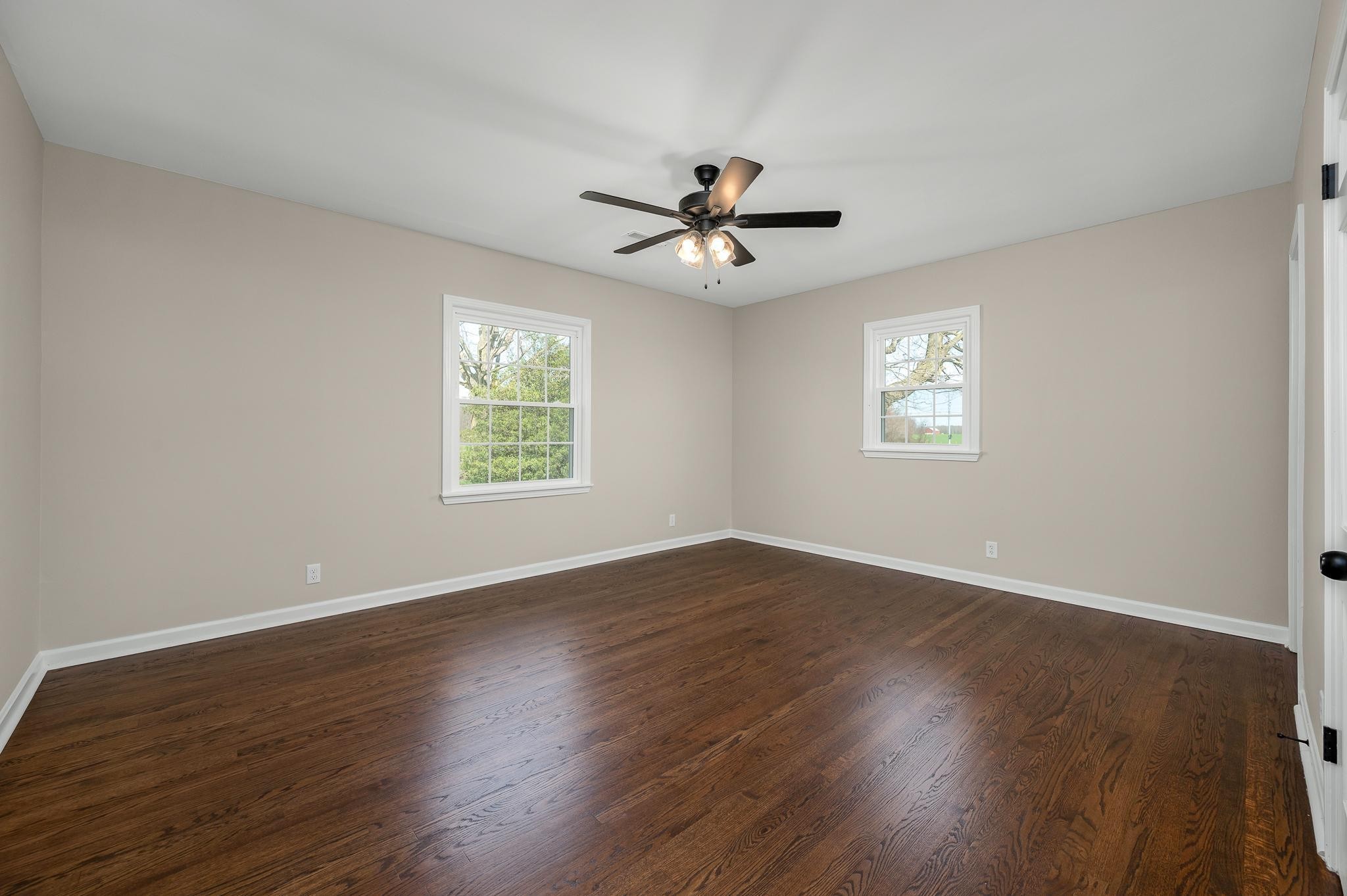 2771 Kinneys Road Cedar Hill, TN 37032 - Photo 20 of 45 a view of an empty room with wooden floor and a window