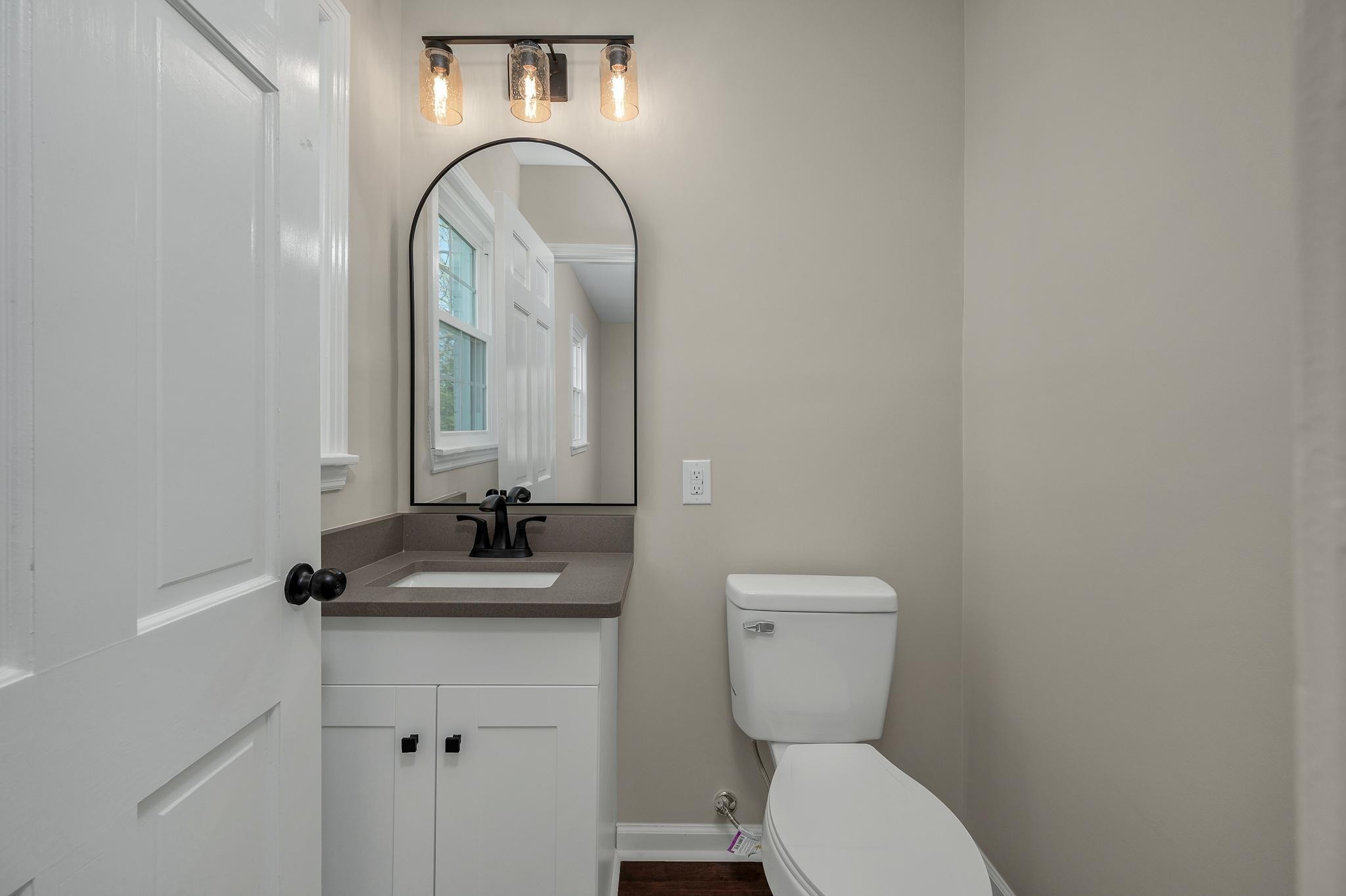 2771 Kinneys Road Cedar Hill, TN 37032 - Photo 21 of 45 a bathroom with a toilet sink and mirror