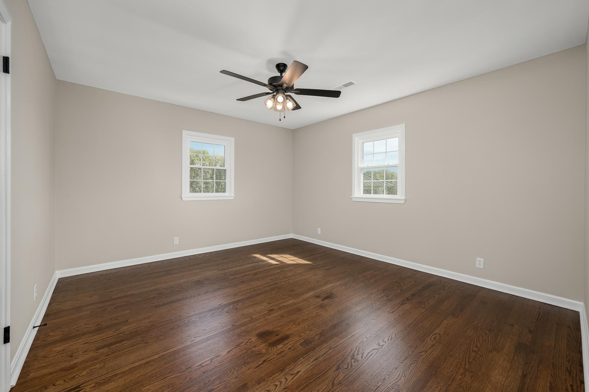 2771 Kinneys Road Cedar Hill, TN 37032 - Photo 23 of 45 a view of an empty room with wooden floor and a window