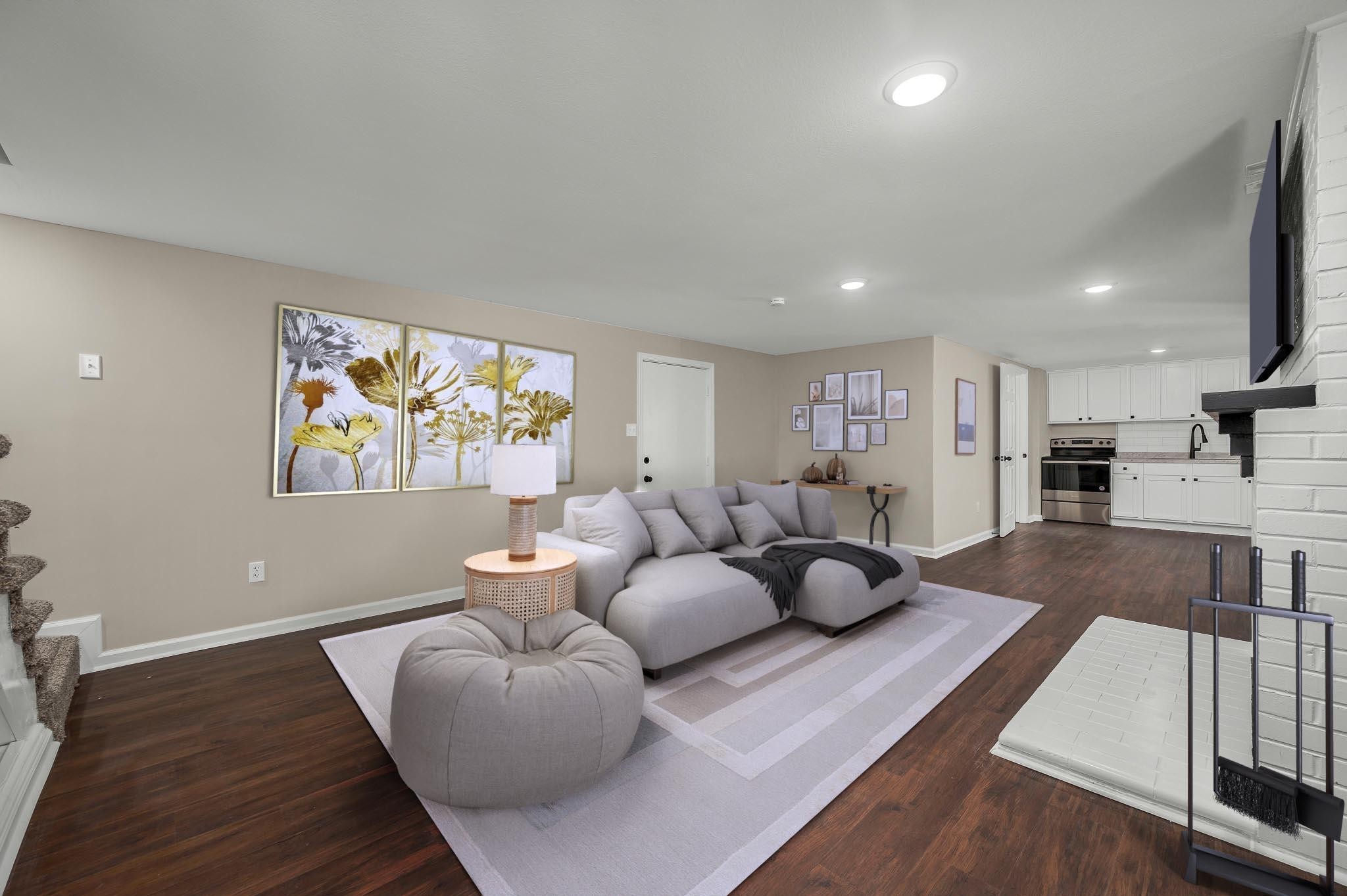2771 Kinneys Road Cedar Hill, TN 37032 - Photo 26 of 45 a living room with furniture and wooden floor