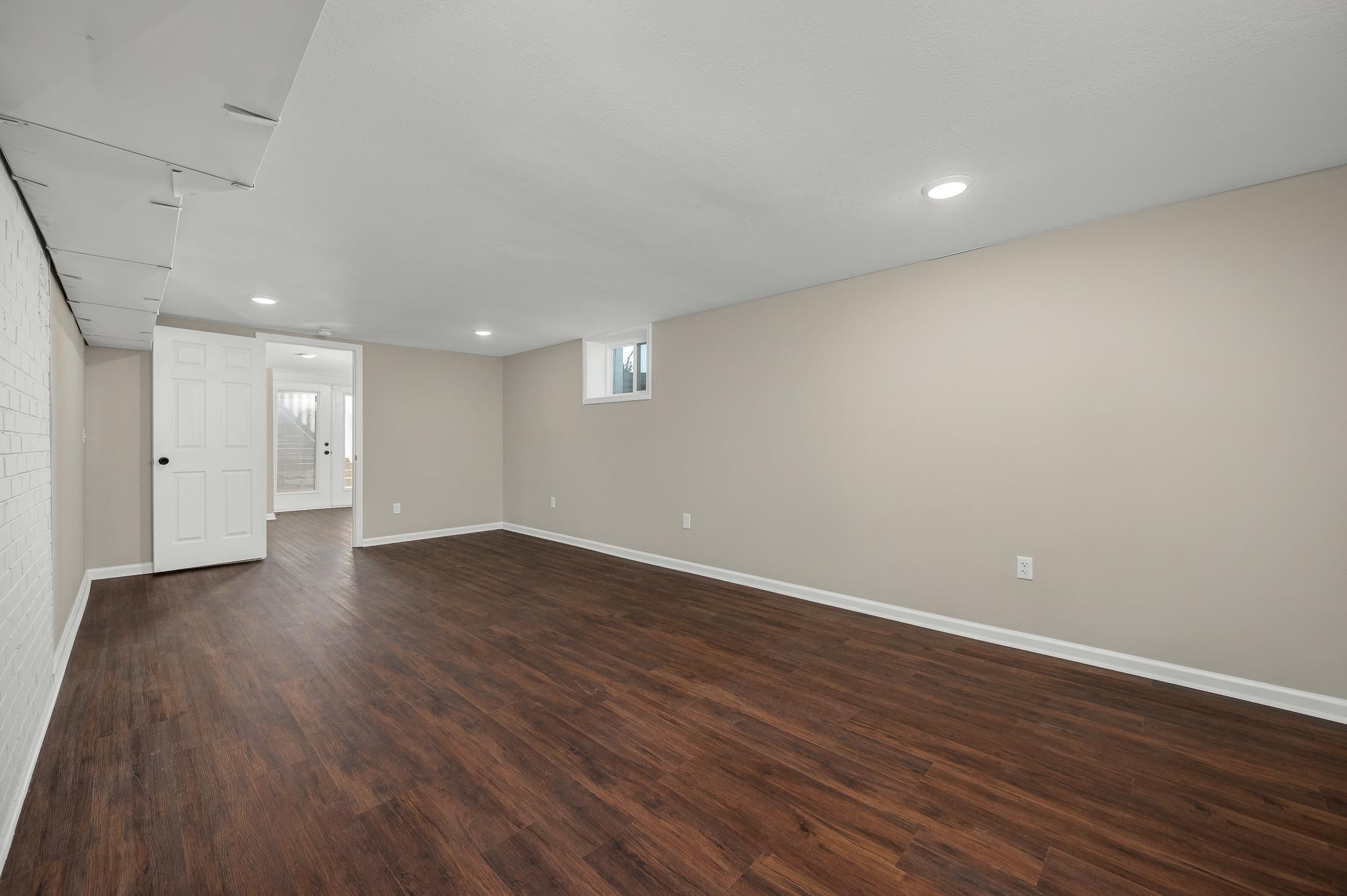 2771 Kinneys Road Cedar Hill, TN 37032 - Photo 35 of 45 a view of an empty room with wooden floor