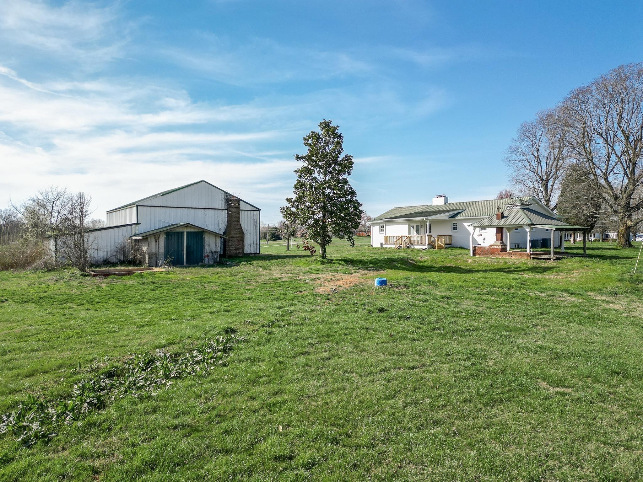 2771 Kinneys Road Cedar Hill, TN 37032 - Photo 42 of 45 a front view of a house with garden