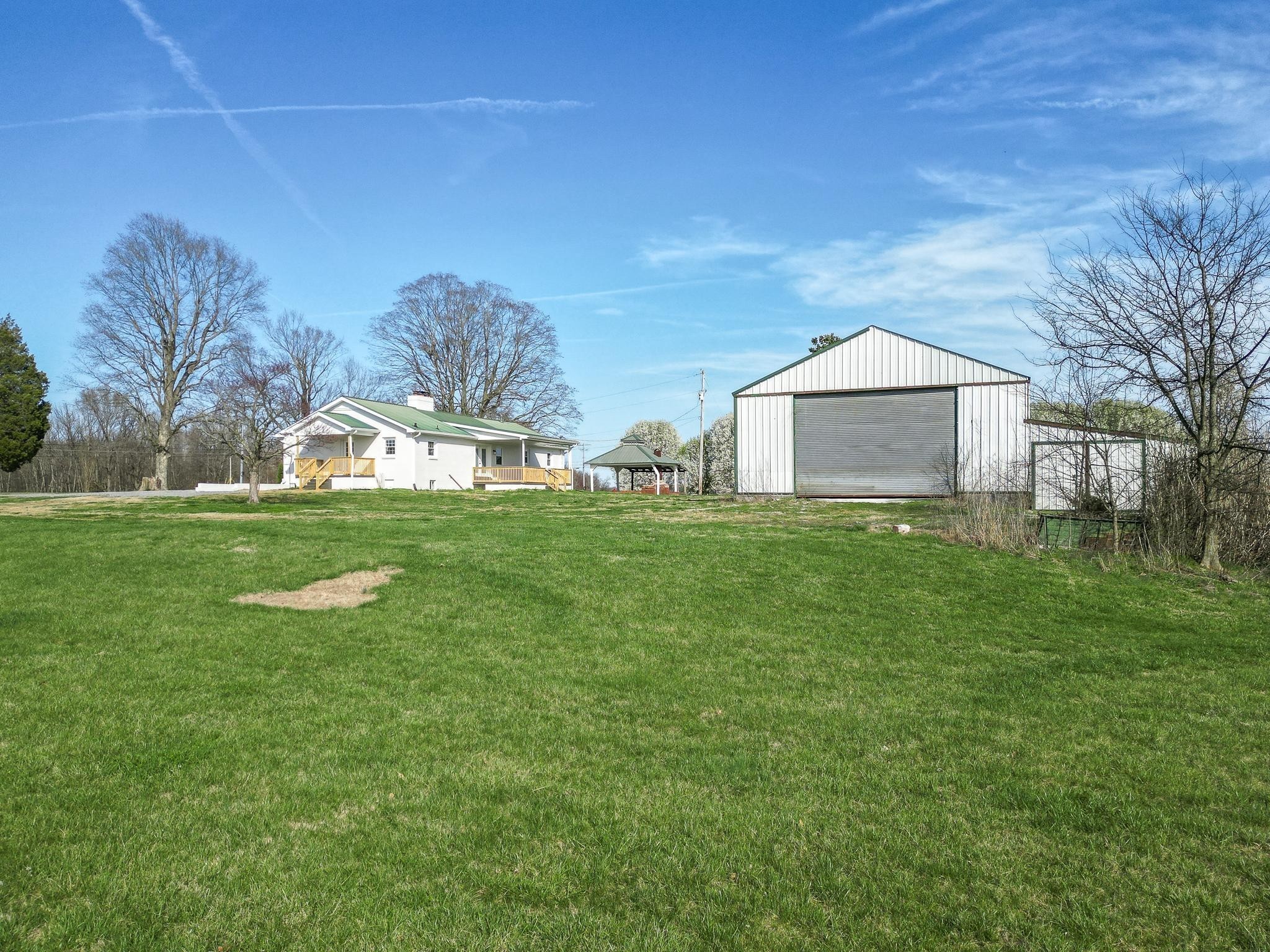 2771 Kinneys Road Cedar Hill, TN 37032 - Photo 43 of 45 a view of a house with a yard