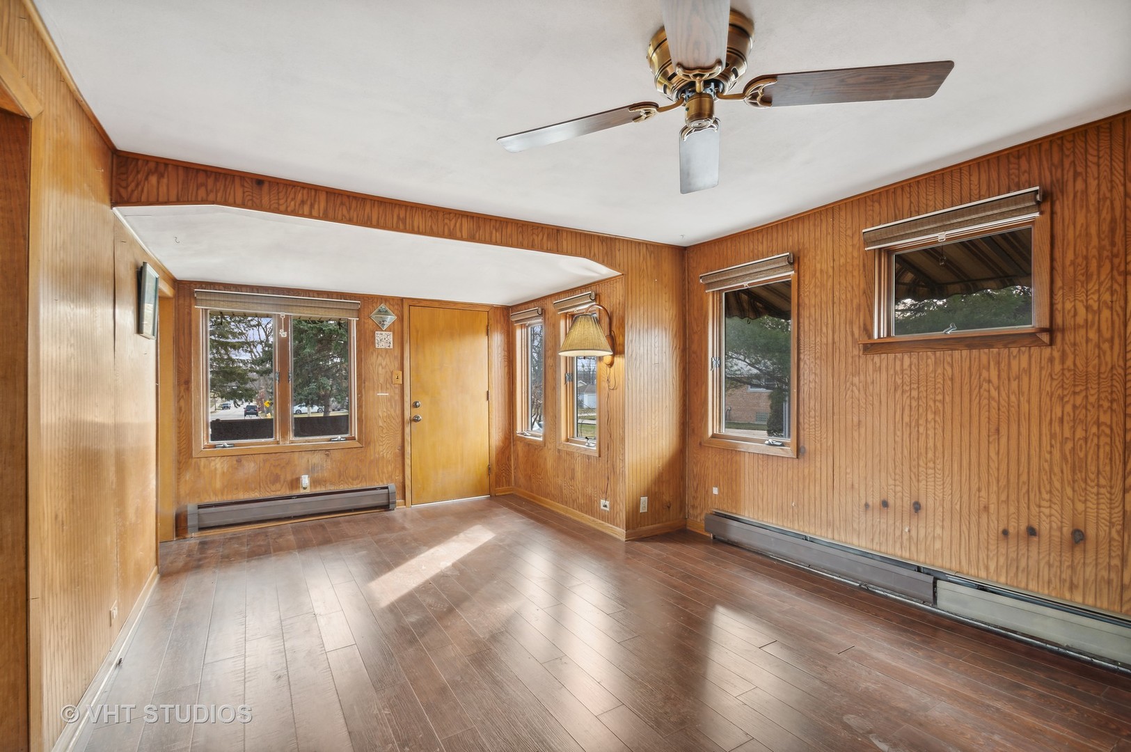 5900 Prospect Avenue Berkeley, IL 60163 - Photo 11 of 14 a view of a livingroom with wooden floor and a ceiling fan