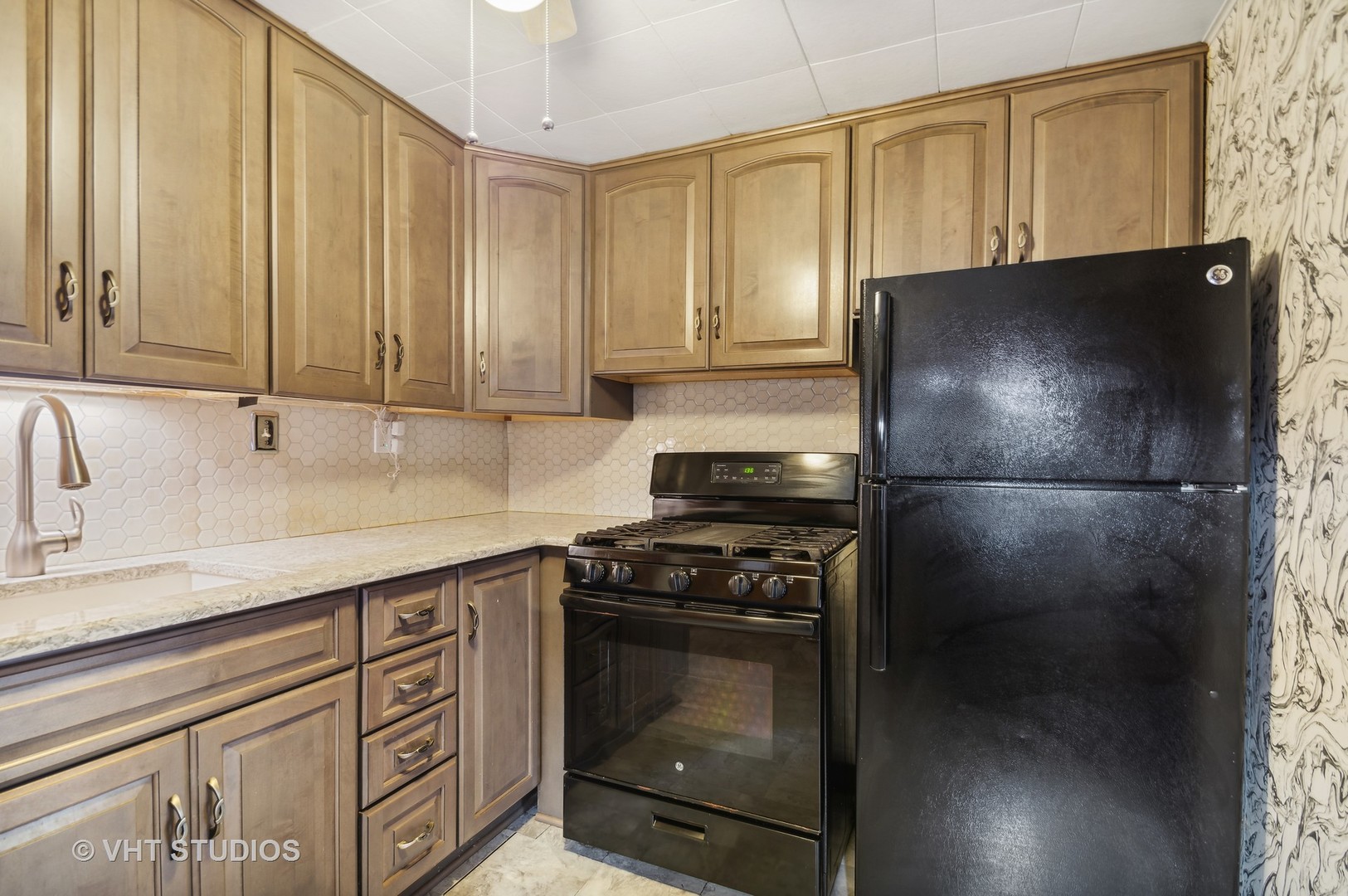 5900 Prospect Avenue Berkeley, IL 60163 - Photo 6 of 14 a kitchen with a refrigerator stove and cabinets