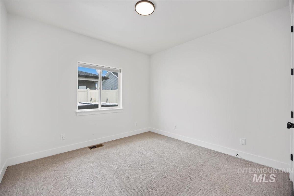 924 Trapper Peak Road Kimberly, ID 83341 - Photo 33 of 40 Spare room with baseboards and light carpet