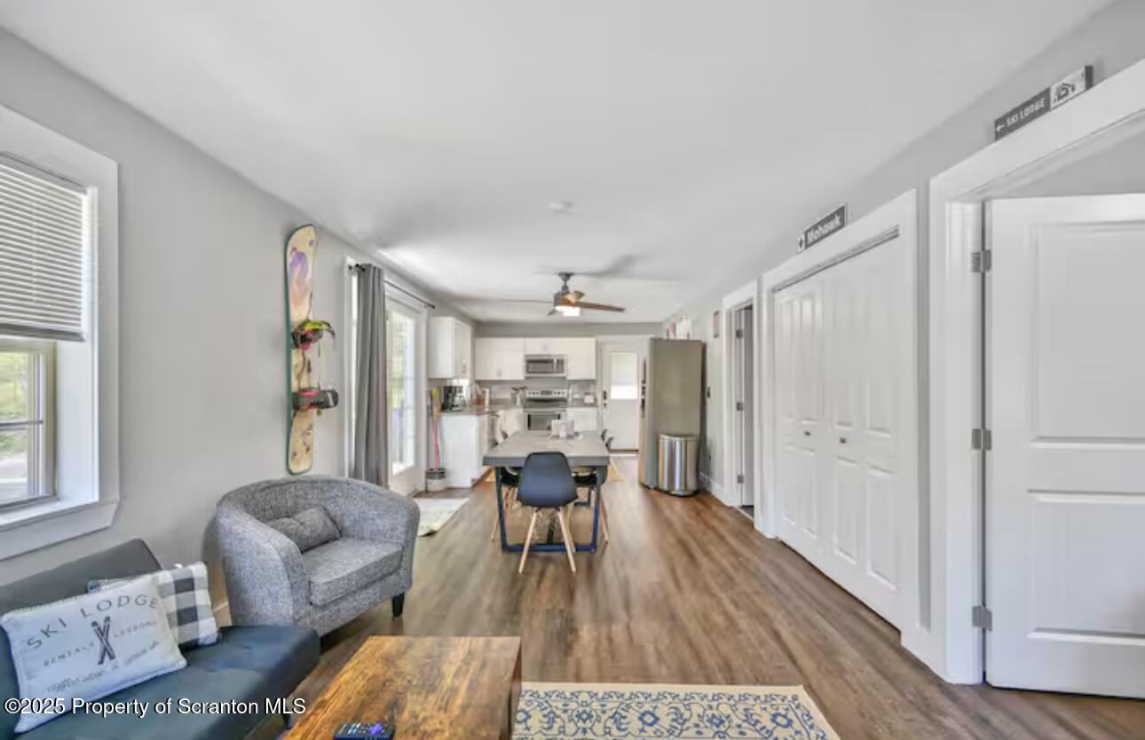 4562 Highway 374 Nicholson, PA 18446 - Photo 15 of 43 a living room with furniture and a wooden floor