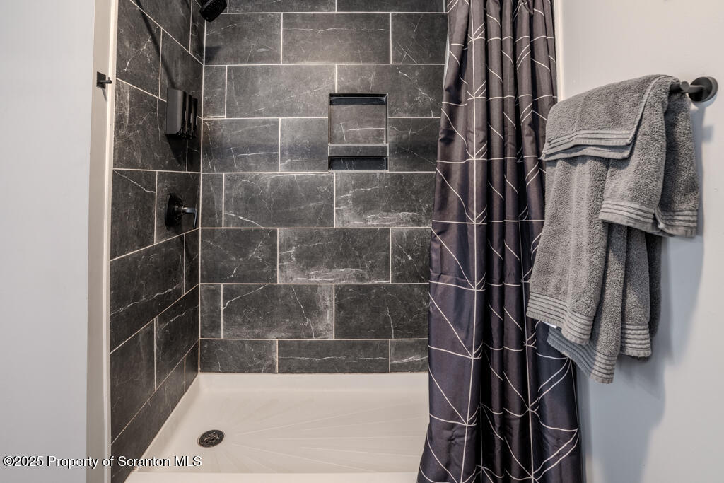 4562 Highway 374 Nicholson, PA 18446 - Photo 20 of 43 a bathroom with a tub