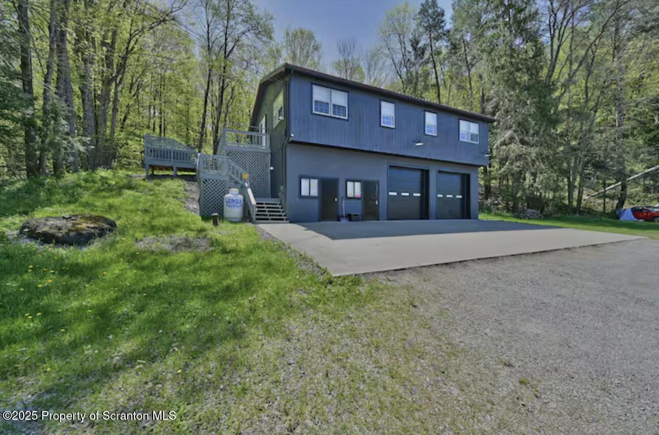 4562 Highway 374 Nicholson, PA 18446 - Photo 2 of 43 a view of a house with a yard