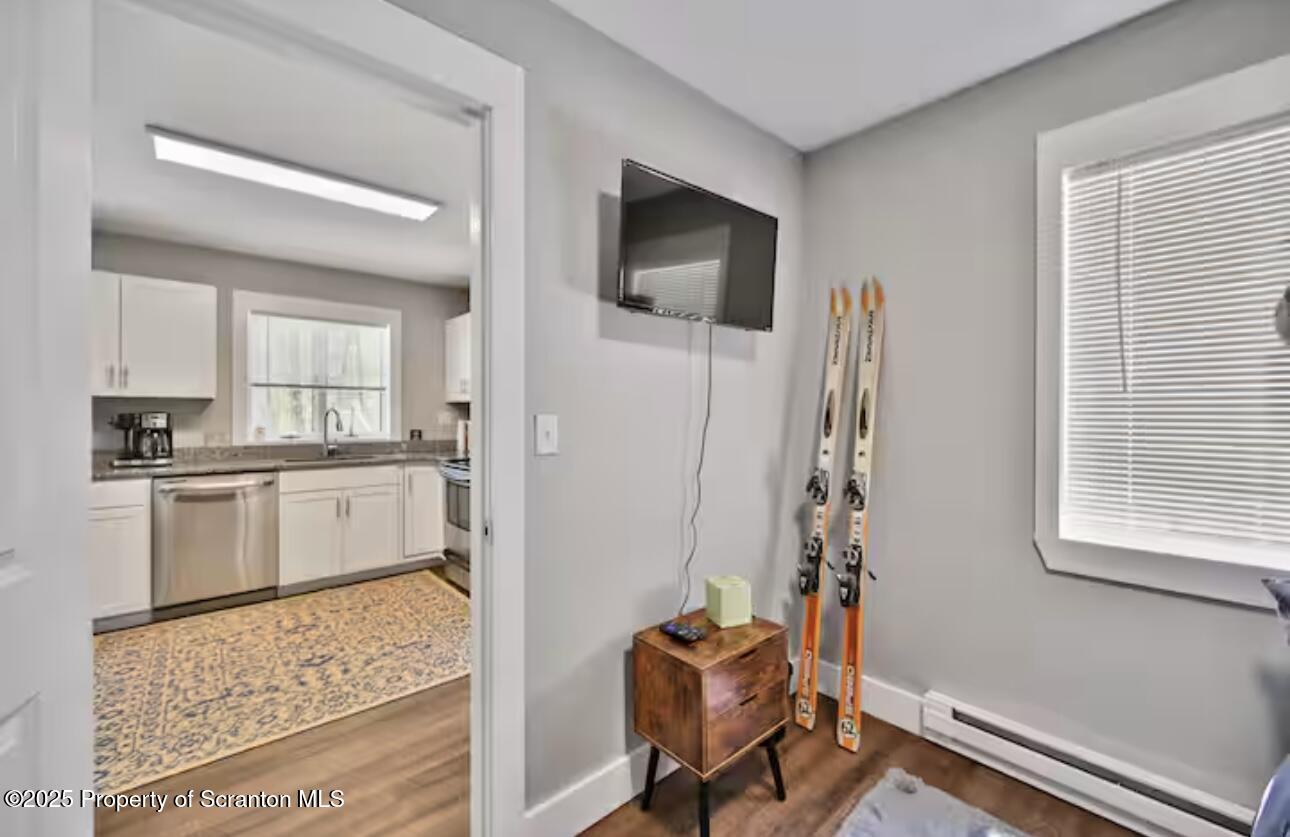 4562 Highway 374 Nicholson, PA 18446 - Photo 26 of 43 a kitchen with stainless steel appliances kitchen island granite countertop a refrigerator and a stove top oven