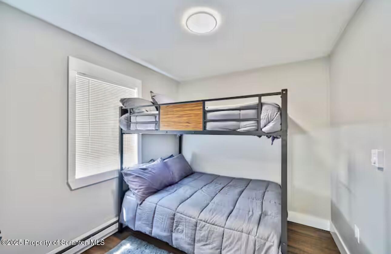 4562 Highway 374 Nicholson, PA 18446 - Photo 30 of 43 a bedroom with a bed and window