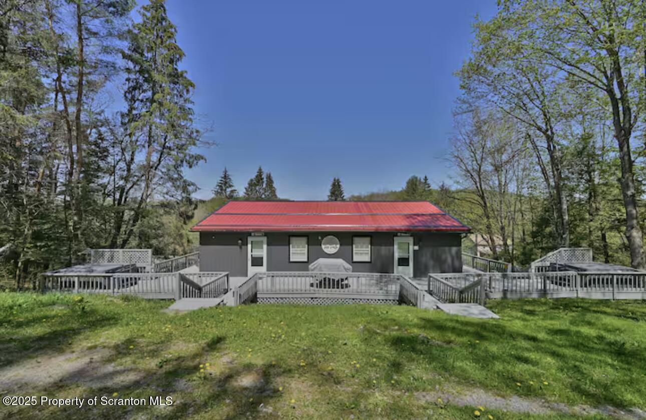 4562 Highway 374 Nicholson, PA 18446 - Photo 3 of 43 a view of a house with a yard and sitting area
