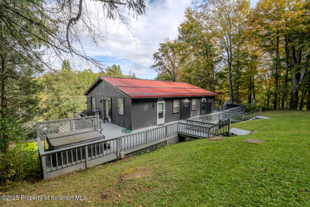 4562 Highway 374 Nicholson, PA 18446 - Photo 4 of 43 a front view of a house with garden