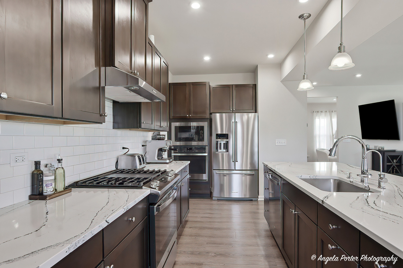 7443 Alexandra Lane Union, IL 60180 - Photo 15 of 39 a kitchen with kitchen island granite countertop stainless steel appliances a sink stove top oven and refrigerator