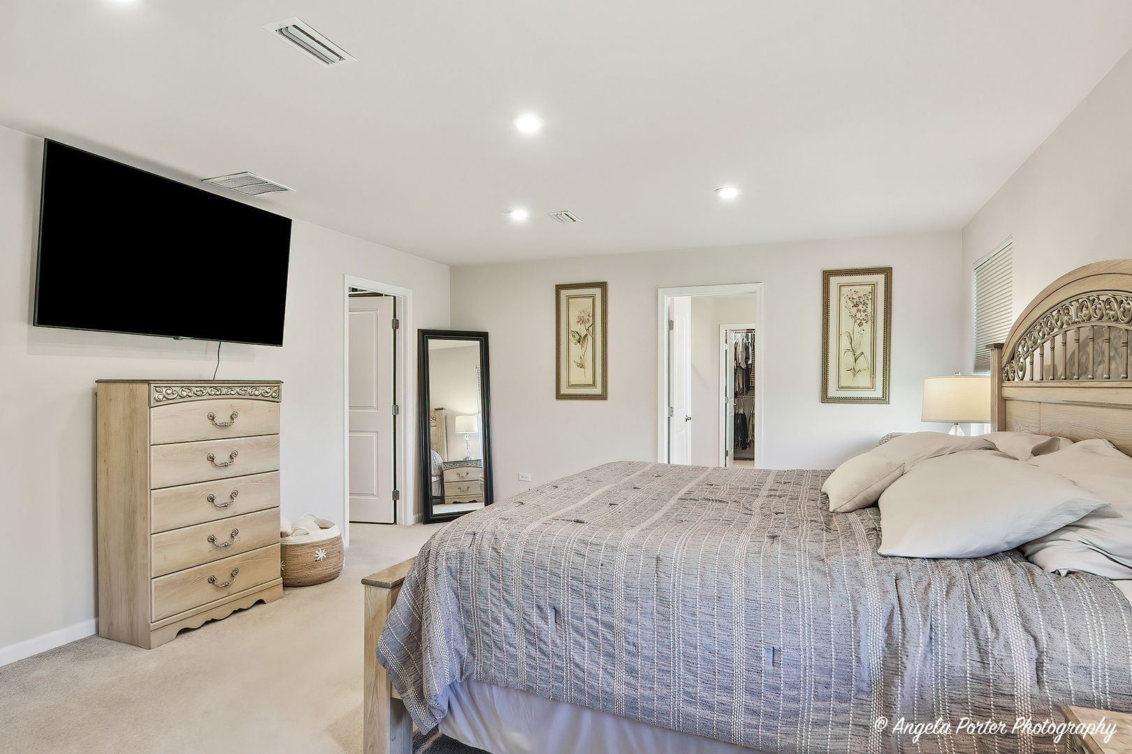 7443 Alexandra Lane Union, IL 60180 - Photo 23 of 39 a spacious bedroom with a bed and a flat screen television