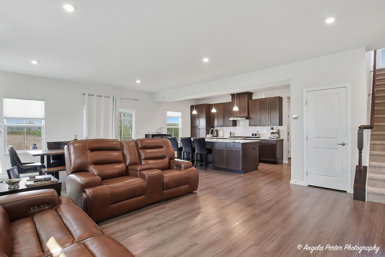 7443 Alexandra Lane Union, IL 60180 - Photo 7 of 39 a living room with furniture and a kitchen view