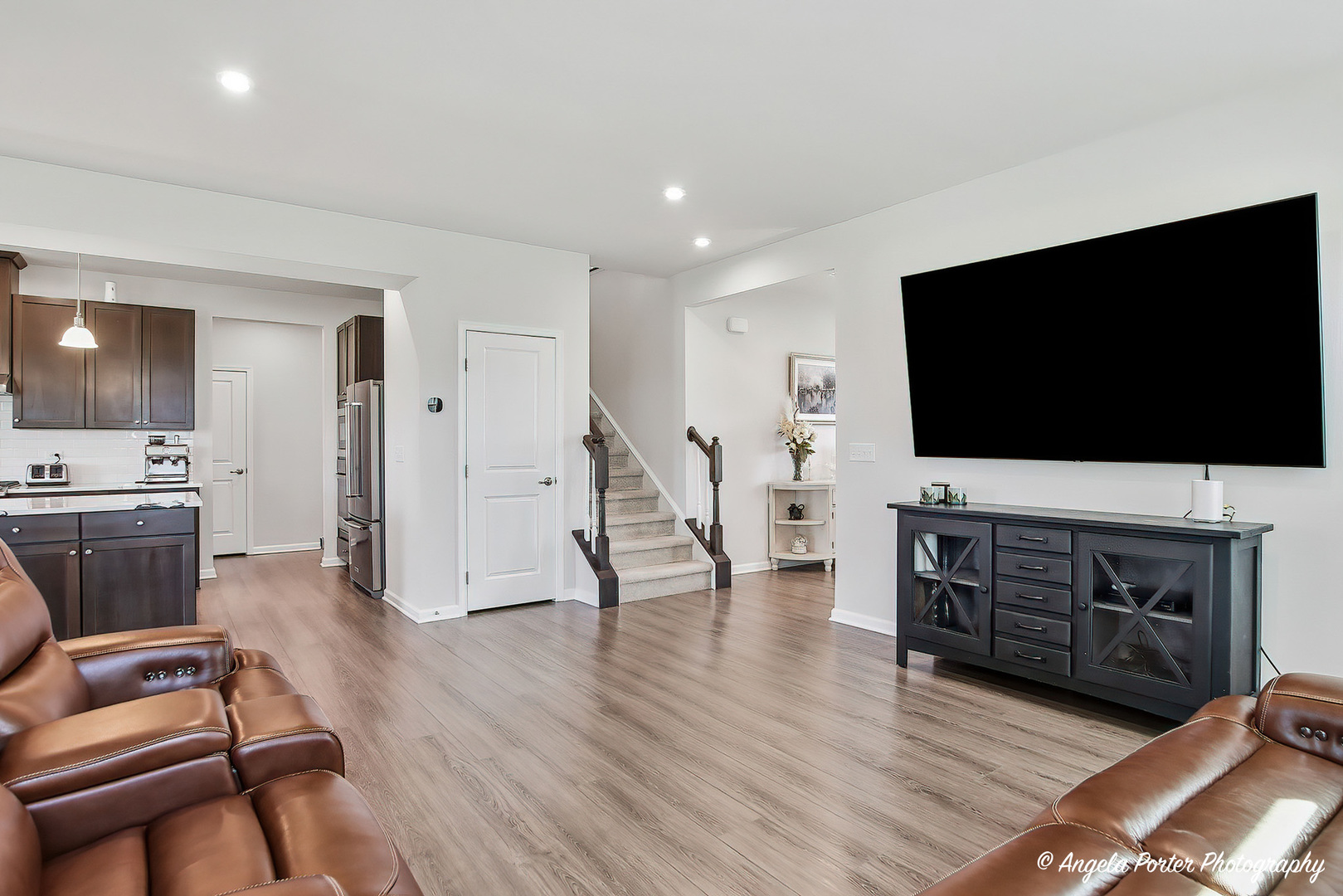 7443 Alexandra Lane Union, IL 60180 - Photo 8 of 39 a living room with furniture and a flat screen tv