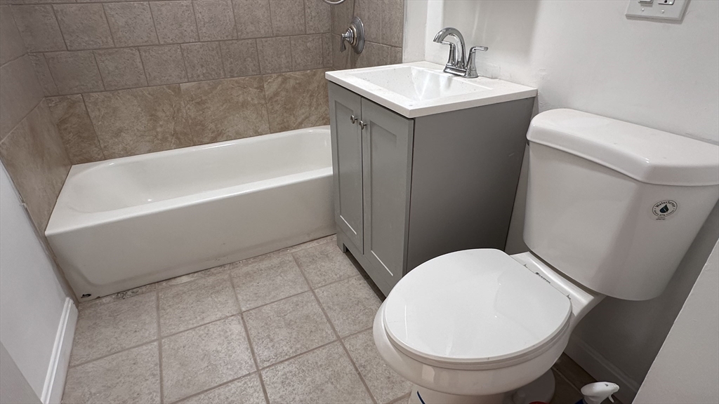 46 Theodore Street Boston, MA 02124 - Photo 13 of 32 a bathroom with a sink and a toilet