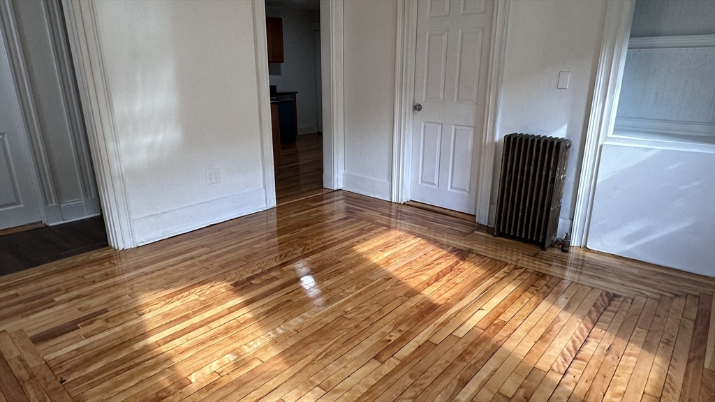 46 Theodore Street Boston, MA 02124 - Photo 20 of 32 a view of front door with wooden floor