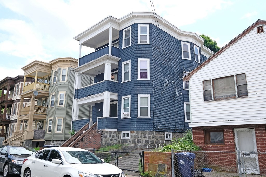 46 Theodore Street Boston, MA 02124 - Photo 32 of 32 a front view of a building with balcony