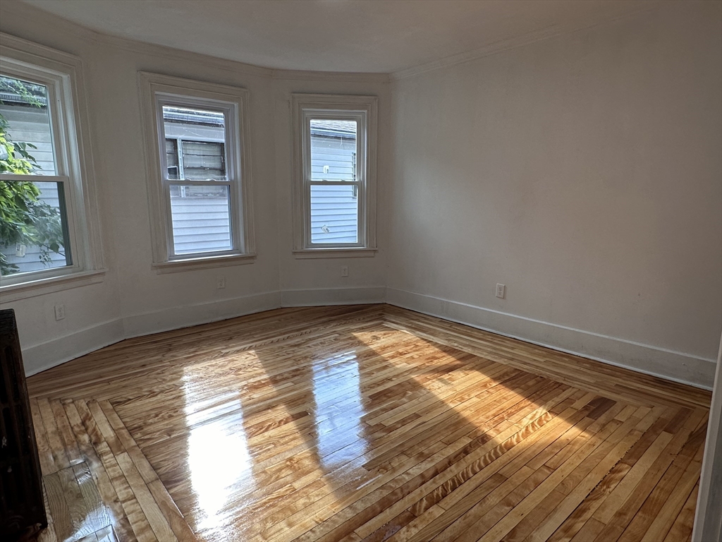 46 Theodore Street Boston, MA 02124 - Photo 7 of 32 a view of empty room with wooden floor
