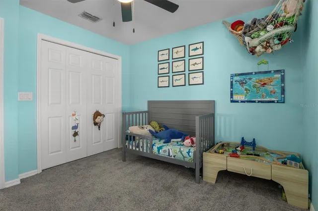 a living room with furniture and baby toys