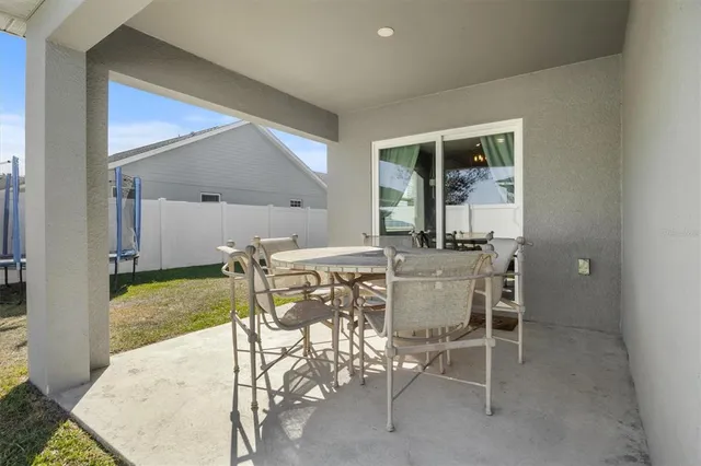 a dining room with furniture and a yard