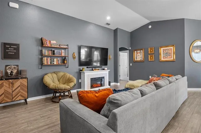 a living room with furniture and a flat screen tv
