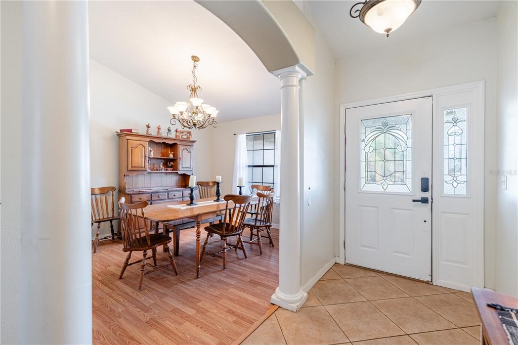 4530 Treasure Cay Road Tavares, FL 32778 - Photo 12 of 60 a view of a dining room with furniture and chandelier