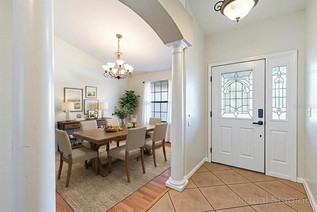 4530 Treasure Cay Road Tavares, FL 32778 - Photo 13 of 60 a view of a dining room with furniture and chandelier