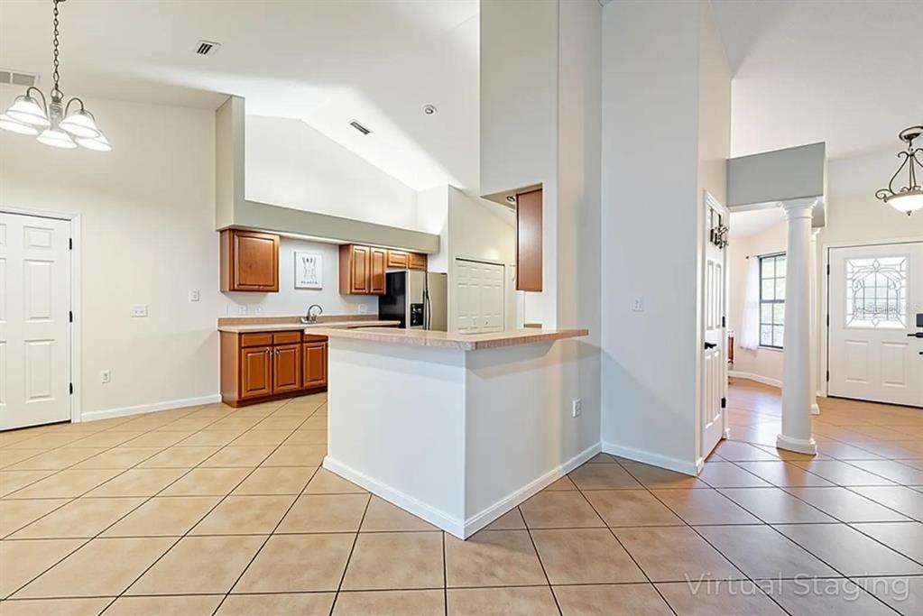4530 Treasure Cay Road Tavares, FL 32778 - Photo 18 of 60 a view of a kitchen with microwave and cabinets