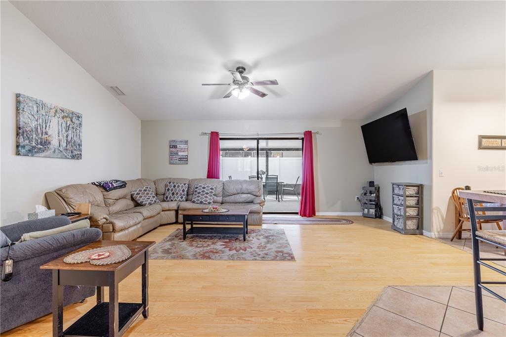 4530 Treasure Cay Road Tavares, FL 32778 - Photo 28 of 60 a living room with furniture and a flat screen tv