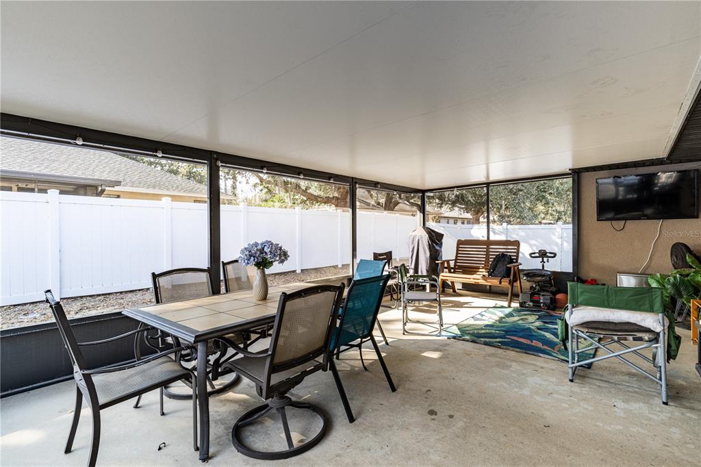 4530 Treasure Cay Road Tavares, FL 32778 - Photo 50 of 60 a view of a dining room with furniture window and outside view