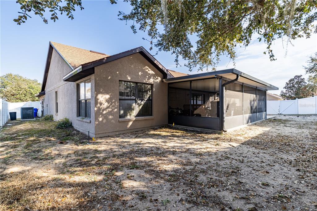 4530 Treasure Cay Road Tavares, FL 32778 - Photo 53 of 60 a view of a house with a yard