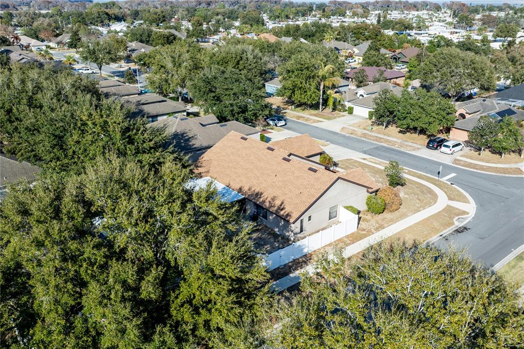 4530 Treasure Cay Road Tavares, FL 32778 - Photo 56 of 60 an aerial view of a house with yard and swimming pool