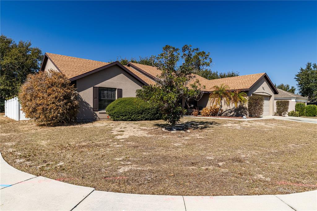 4530 Treasure Cay Road Tavares, FL 32778 - Photo 6 of 60 a front view of a house with a yard