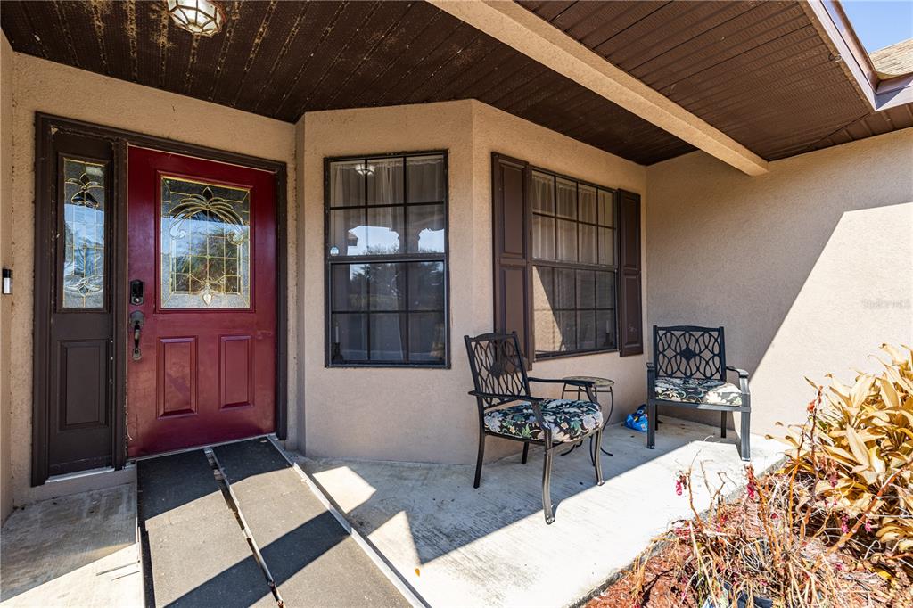 4530 Treasure Cay Road Tavares, FL 32778 - Photo 8 of 60 a building outdoor space with patio furniture