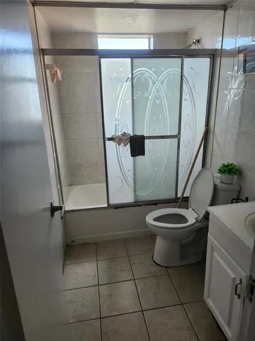 a bathroom with a toilet a sink and a shower