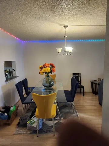 a kitchen with stainless steel appliances a stove a sink and a refrigerator