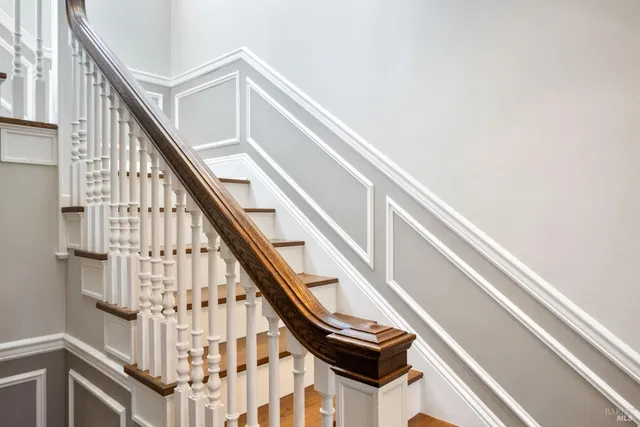 a kitchen with a refrigerator a stove and a cabinets