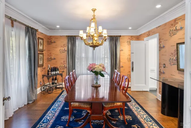 a kitchen with a stove a refrigerator a sink and wooden cabinets